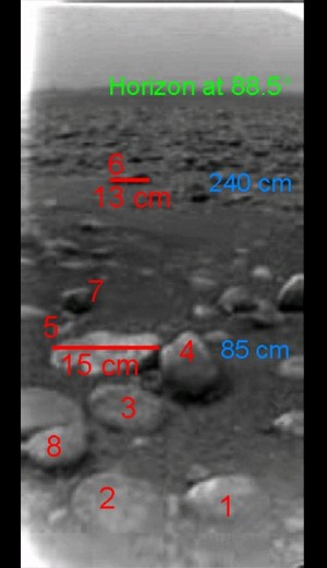Raw image with scales showing the surface at the landing site of the Huygens probe. CREDIT: ESA/NASA/JPL/University of Arizona