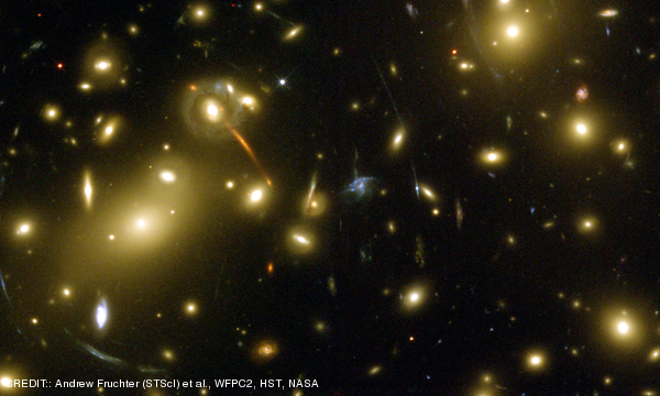 A Hubble Space Telescope image of galaxies in the cluster Abell 2218. This cluster gravitationally lenses, magnifies, and brightens the light from very distant galaxies. CREDIT: Andrew Fruchter (STScI) et al., WFPC2, HST, NASA May 2011 Extra